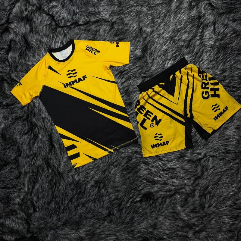 Rash Guard - ชุดกีฬา IMMAF รุ่นใหม่ ปี 2026 เสื้อยืดแรชการ์ดลายกราฟิกสีดำชมพูสำหรับผู้ชาย